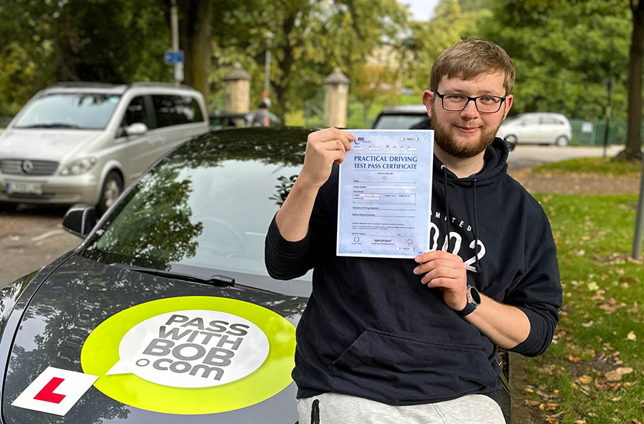 Elliott Milne with his Driving Test Pass Certificate