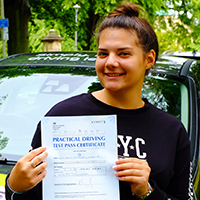 Ani Lukmanova holding her Driving Test Pass certificate