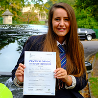 Charis Champness holding her Driving Test Pass certificate