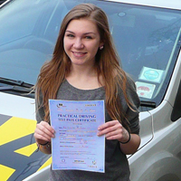 Jennie Gough holding her Driving Test Pass certificate