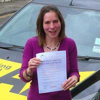 Morna Clay holding her Driving Test Pass certificate