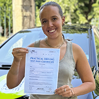 Daisy Mason holding her Driving Test Pass certificate
