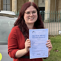 Fizz Dell-Smith holding her Driving Test Pass certificate