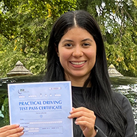 Mary Gallardo holding her Driving Test Pass certificate