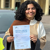 Shriya Shetty holding her Driving Test Pass certificate