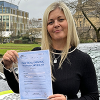 Sophie Haworth holding her Driving Test Pass certificate